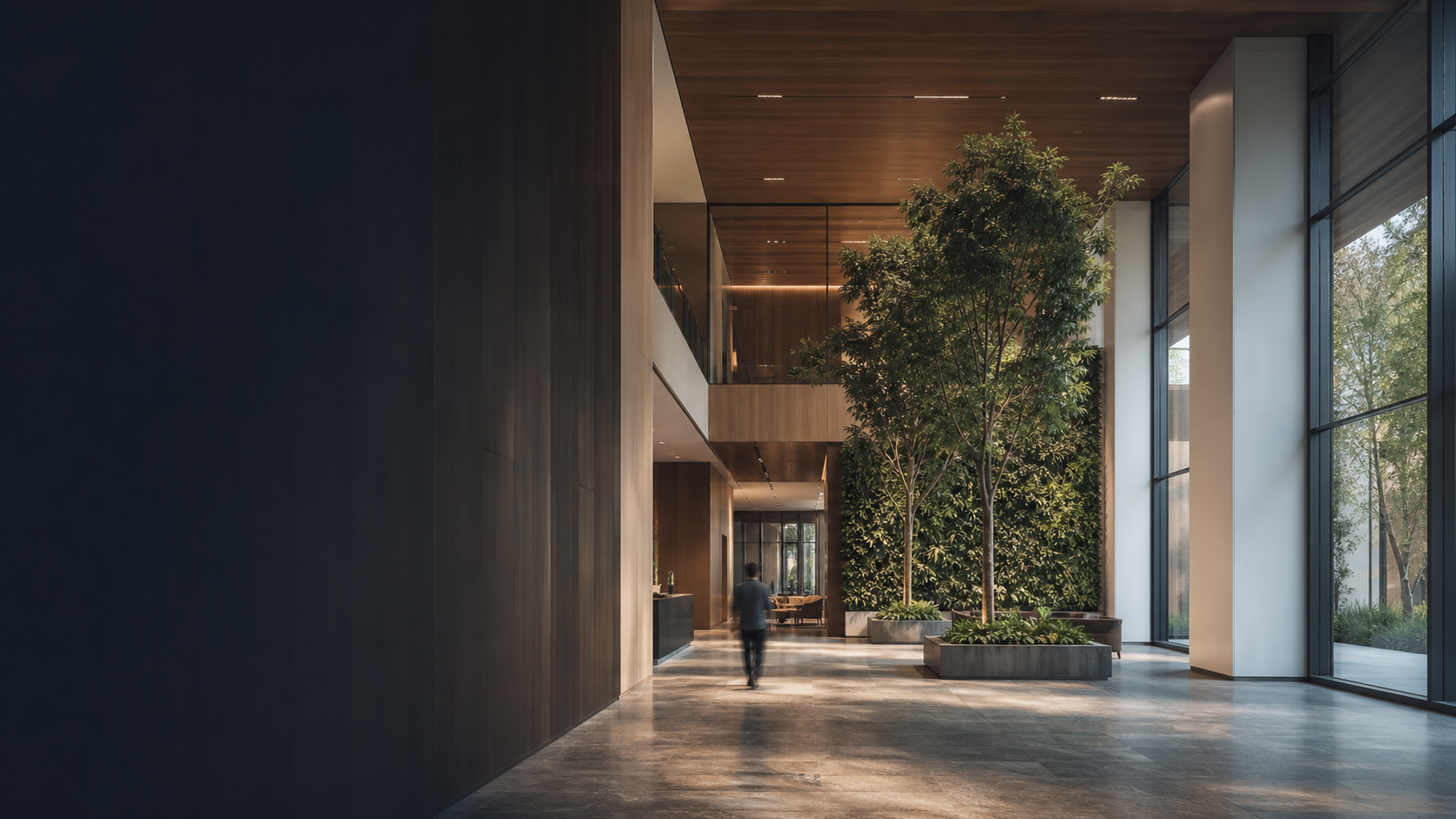 A hotel-calibre arrival lobby with planting and daylight